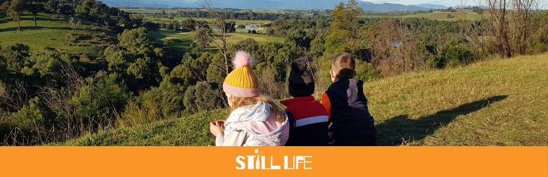 Three kids look over the Yarra Valley.