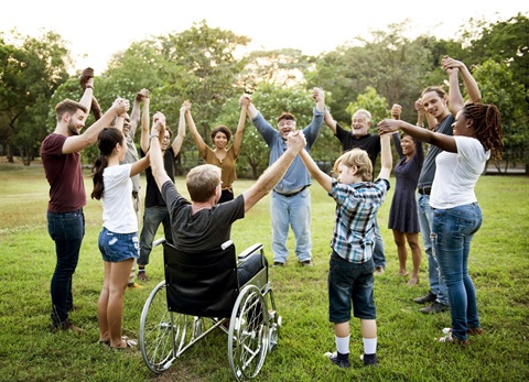 Group standing in circle together.