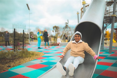 metal slide with young girl