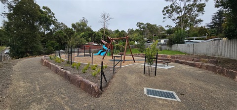 Play space with play equipment 