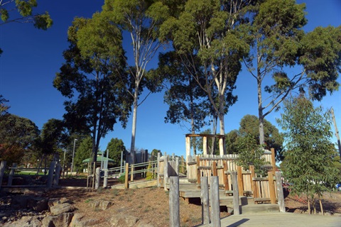 Wooden playground and gum trees at Hookey Park