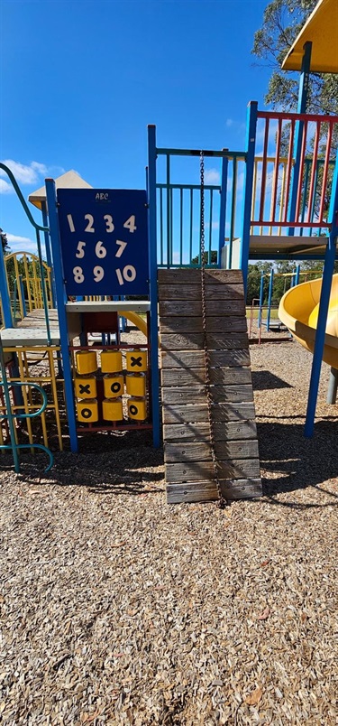 Chain climbing wall with number board and tic-tac-toe