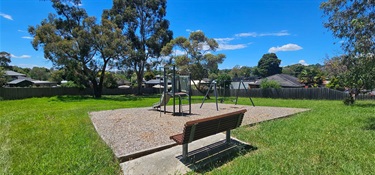 Seat with view of play equipment