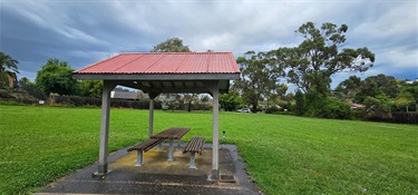 Shelter with picnic table and drinking tap