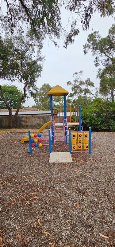 Tower with slide, abacus, tic-tac-toe and climbing elements.