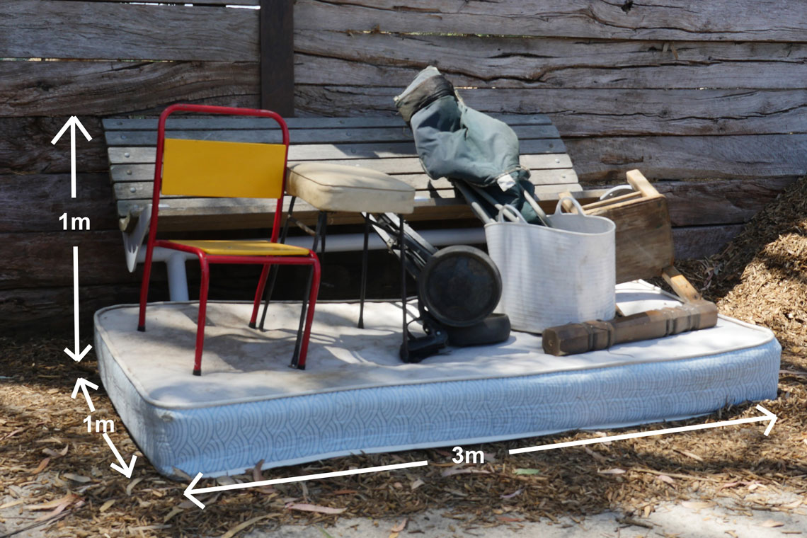 Pile of hard waste including mattress and chair, showing three cubic metres in size